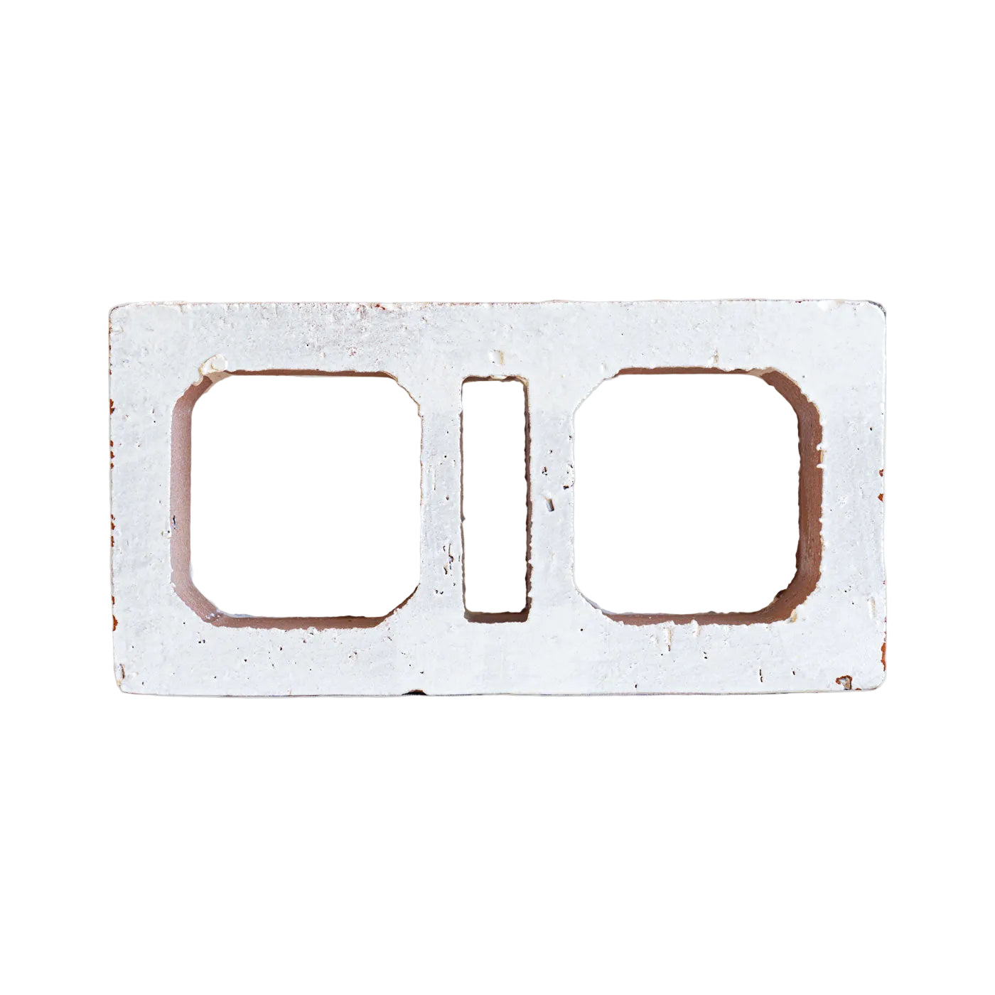 Glazed Ventana White Breeze Block by Clay Imports Breeze Blocks with two square cutouts and a middle rectangle, showing textured, slightly worn edges.