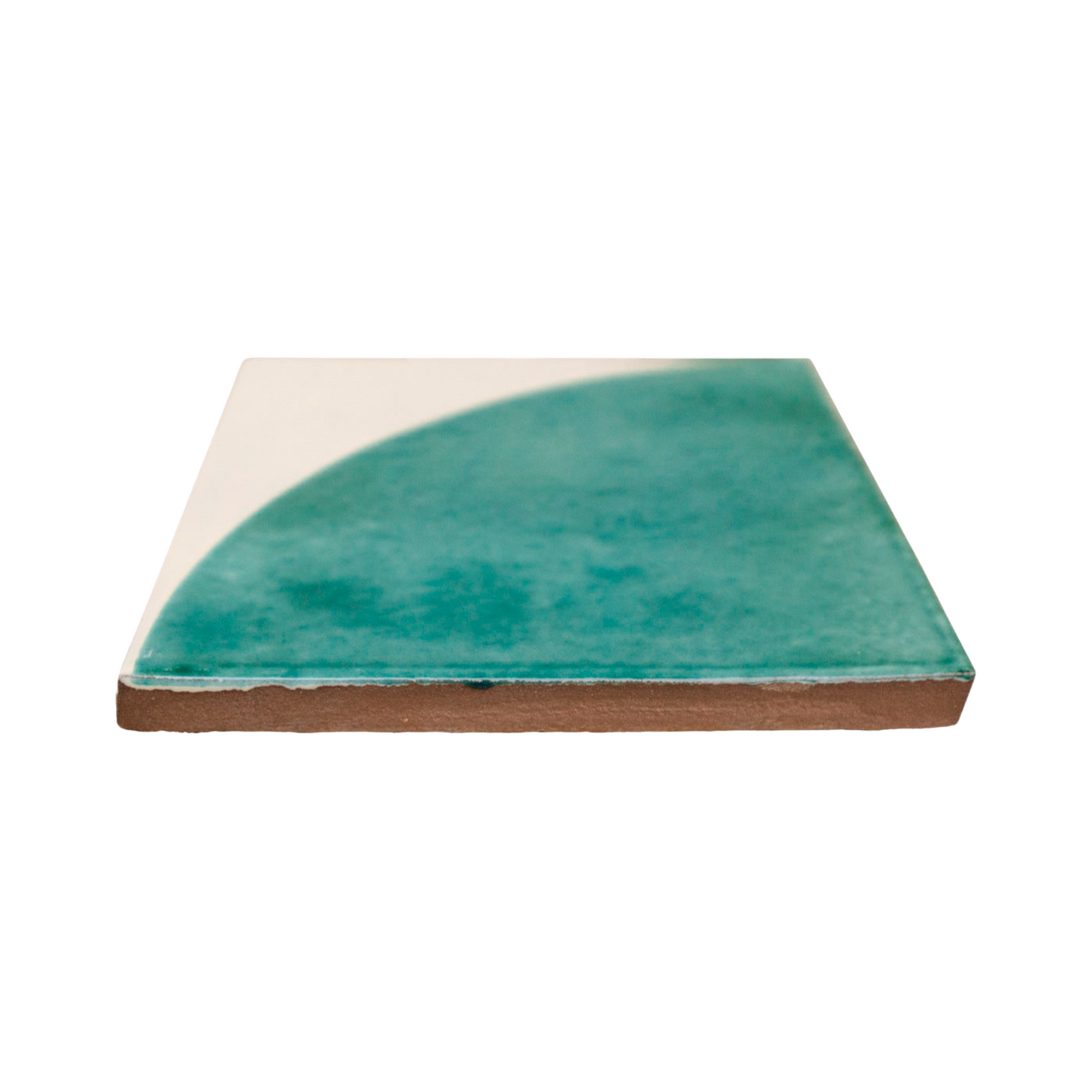 Glossy teal green quarter circle pattern tile by Clay Imports featuring a cream background and shown from a side view.