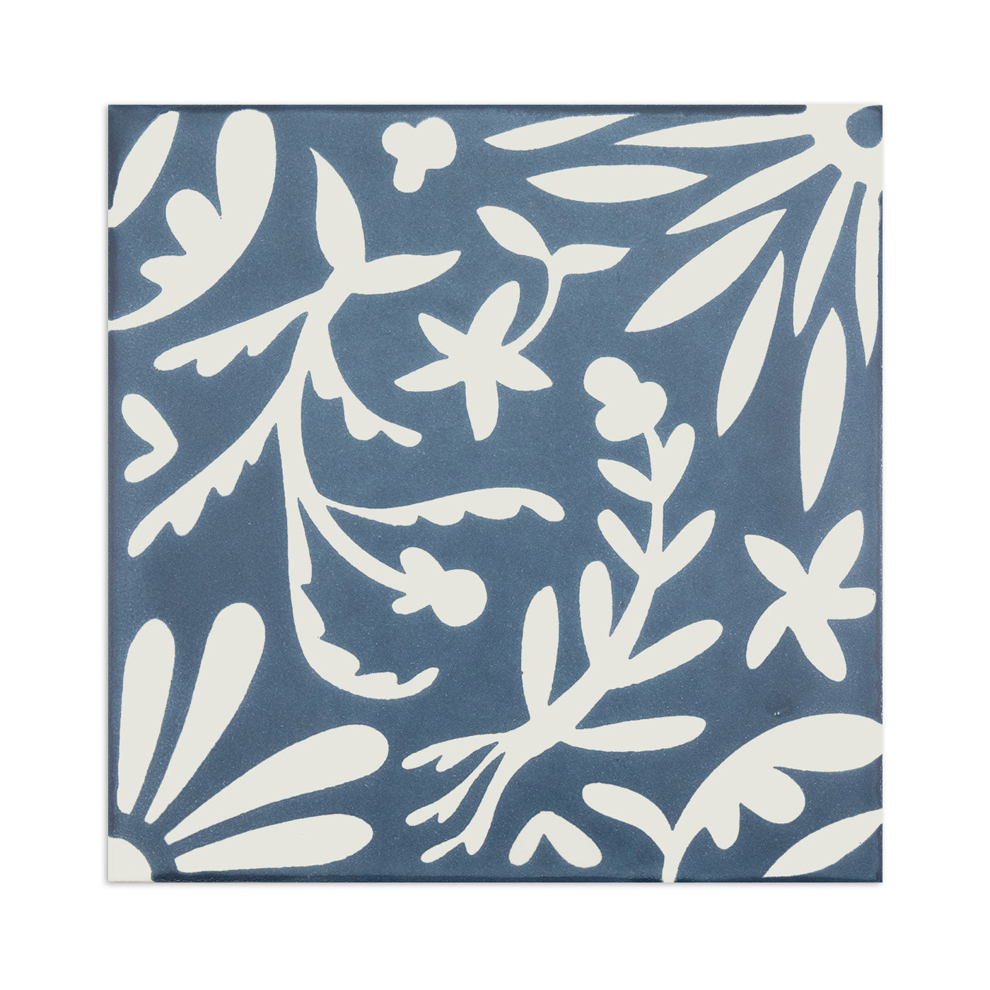 Blue and white tile sample by Clay Imports with a botanical floral pattern.