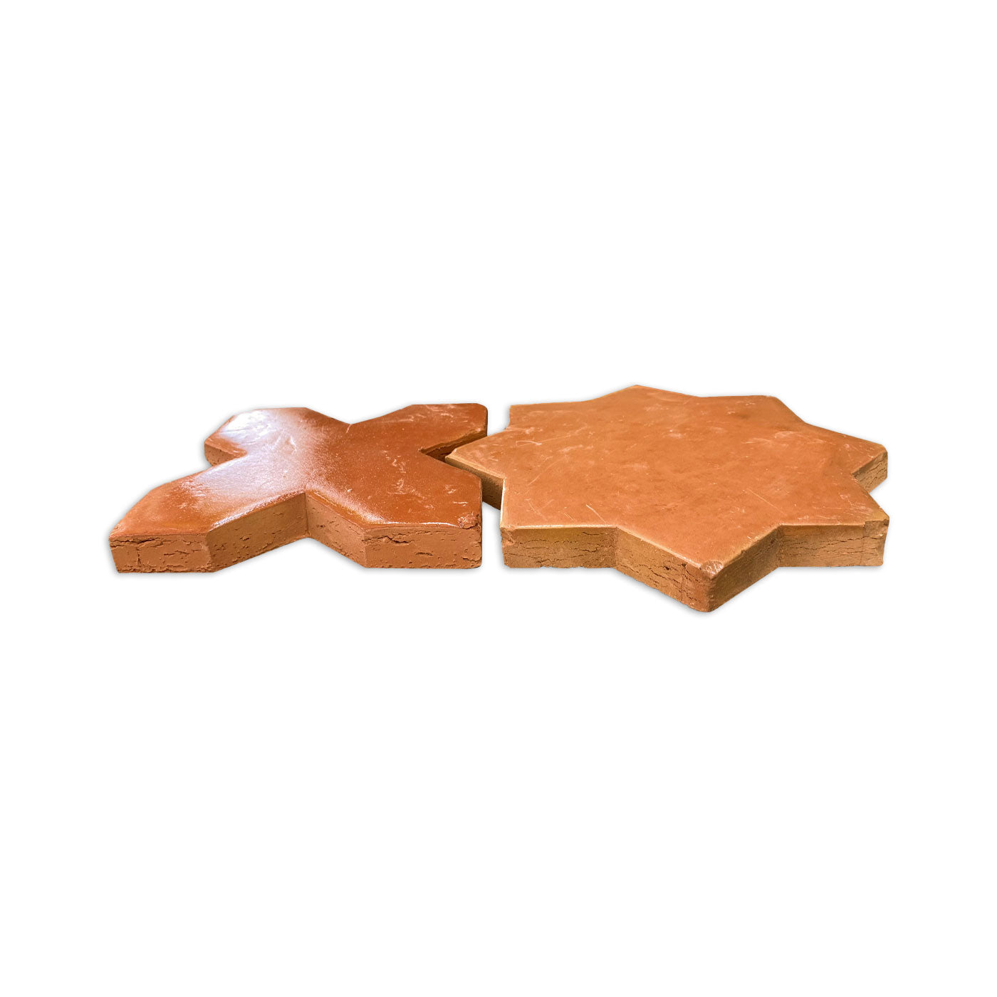 Terracotta Star and Cross tiles by Clay Imports, with a smooth, glossy finish, side-by-side.