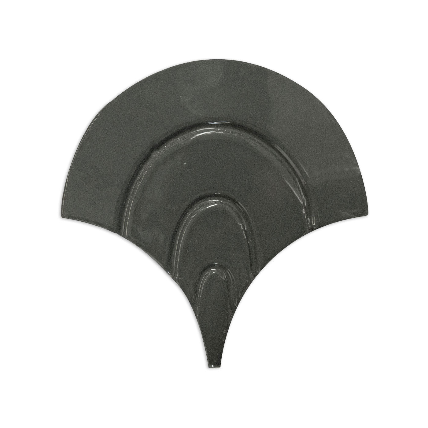 Black fan-shaped tile sample by Clay Imports, featuring raised concentric wave patterns and a smooth finish.