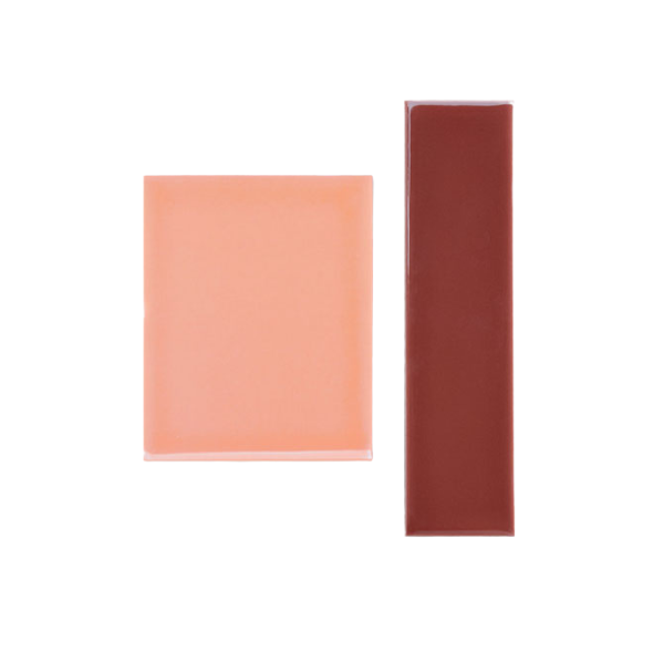 Two rectangular sample tiles by Clay Imports, one burgundy and one light pink, with a glossy finish on a white background.