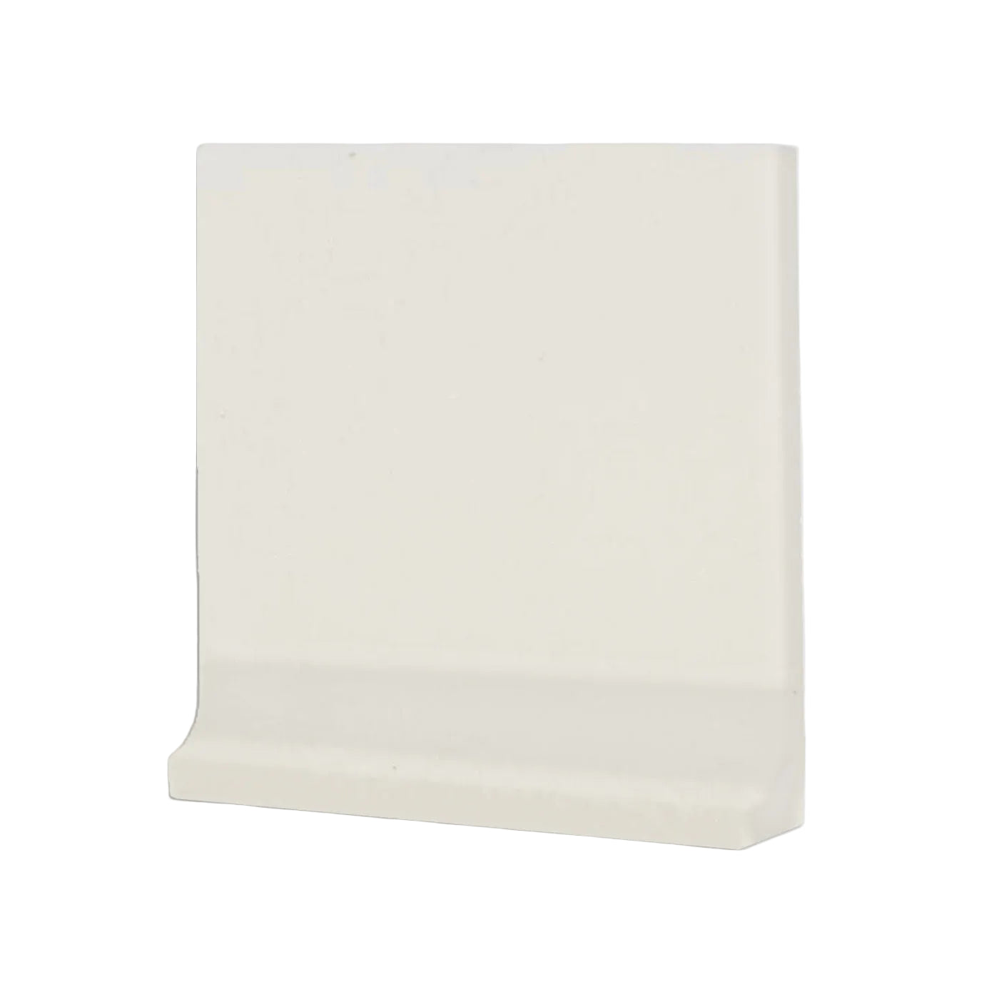 Off-white cove base tile trim by Clay Imports, with a smooth finish and curved bottom edge, angled view.