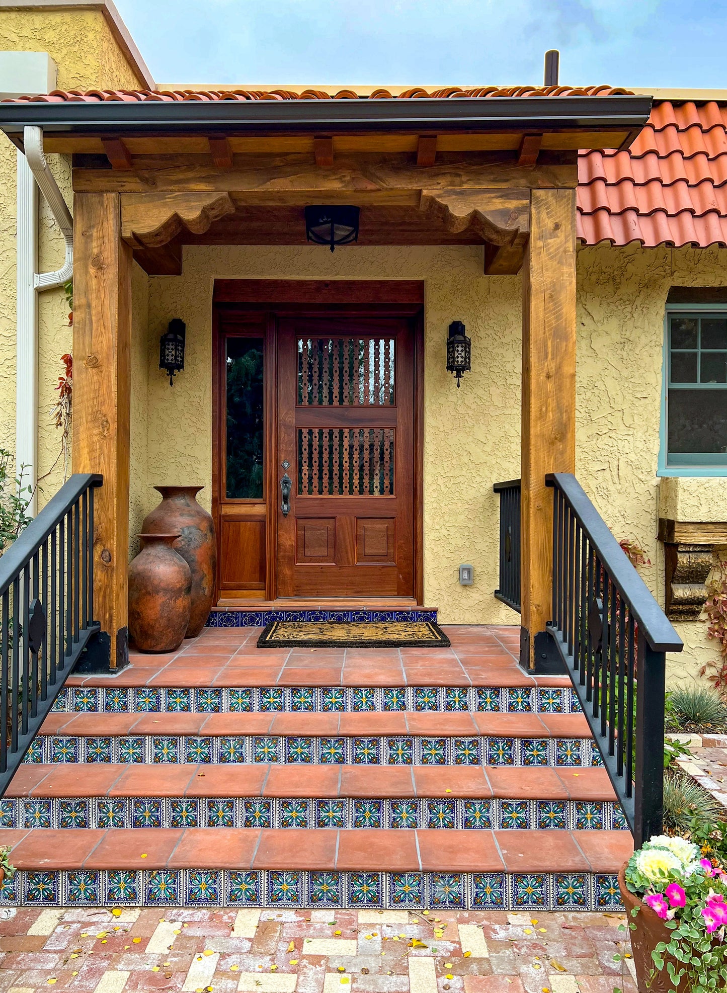 Terracotta Cotto Tierra 13x13 tiles by Clay Imports Handmade Tile, installed on outdoor stair treads with decorative risers.