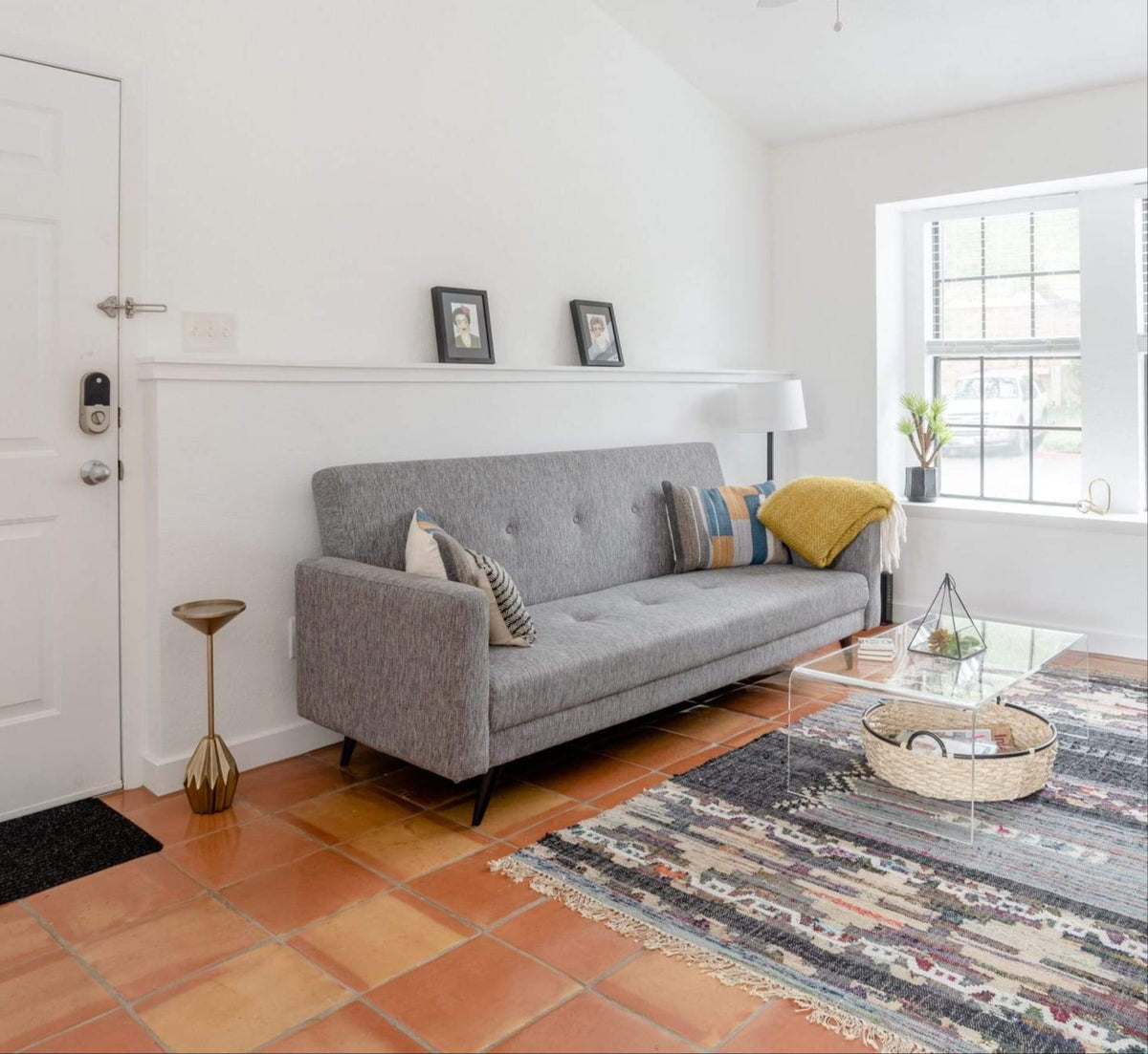 Smooth terracotta floor tiles by Clay Imports in varied reddish-orange and brown tones in a modern living room.