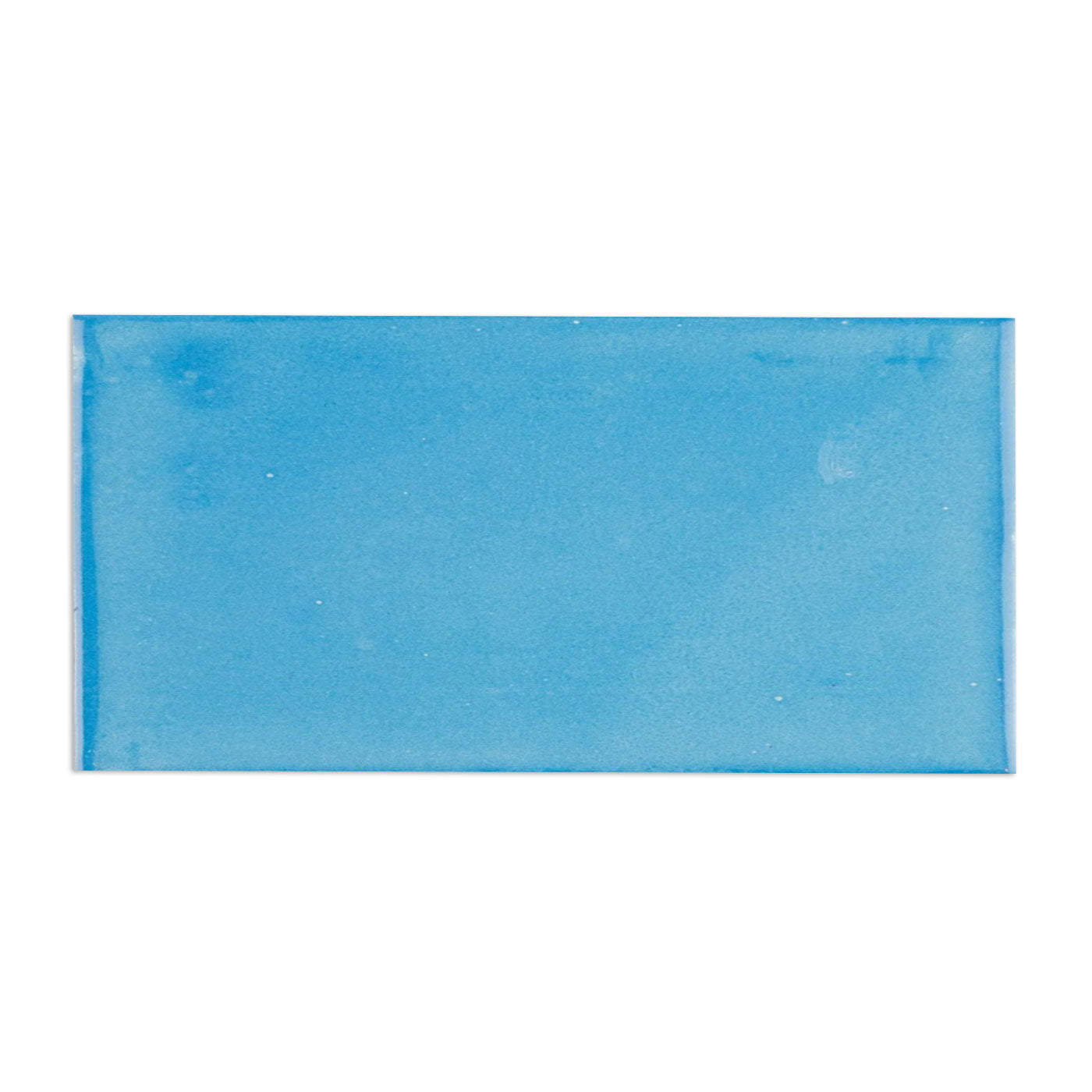 Turquoise sample by Clay Imports with a matte, fine granular texture and lighter edges.