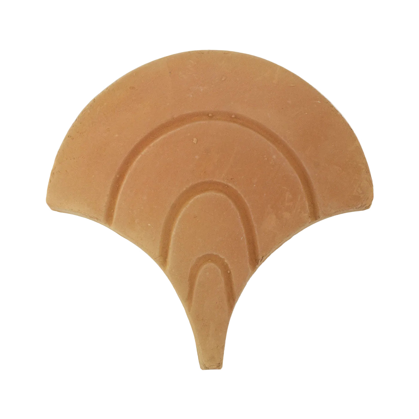 Terracotta fan-shaped tile sample by Clay Imports with raised concentric wave patterns.