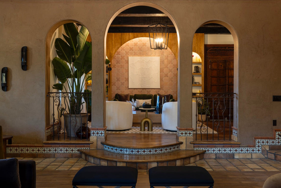 Intricate handmade tiles adorn the steps of a grand, arched lounge, reflecting the Bachelor Mansion's opulent design.