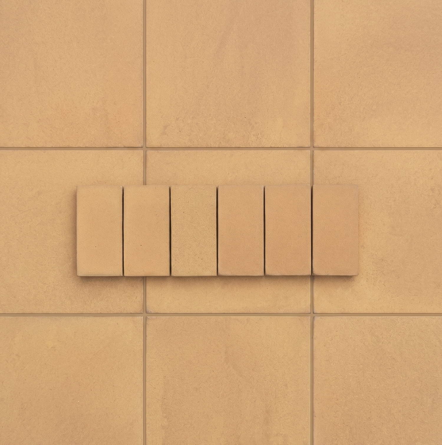 Textured sandy beige Cotto Dune tiles, embodying natural warmth and understated elegance.