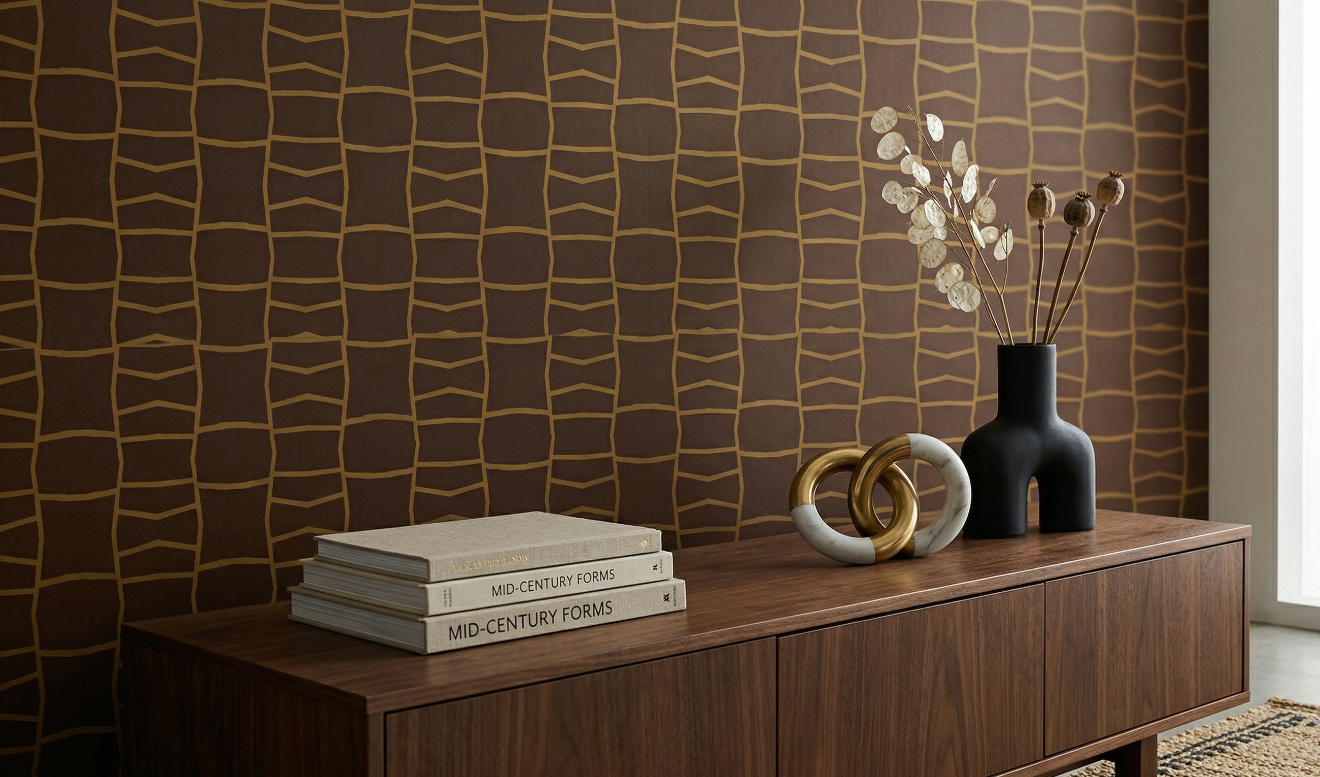 Brown wallpaper with a striking gold geometric pattern, enhancing a sophisticated mid-century interior with elegant decor.