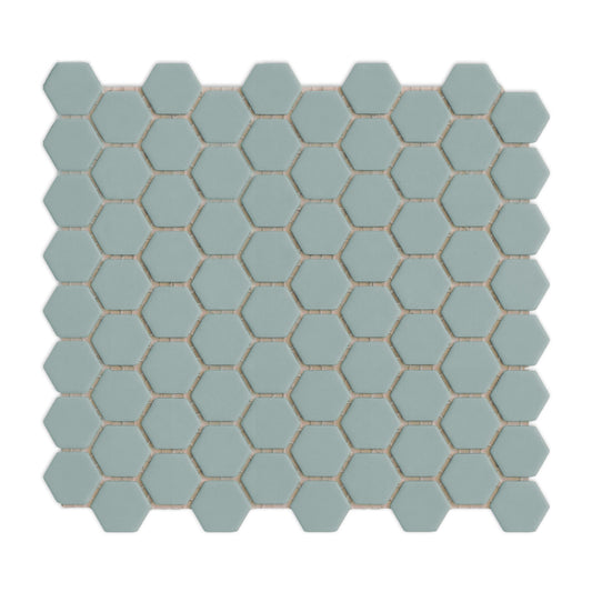 Light gray-green hexagonal clay tiles by Clay Imports, arranged in a geometric cluster with thin white grout lines, casting soft shadows.