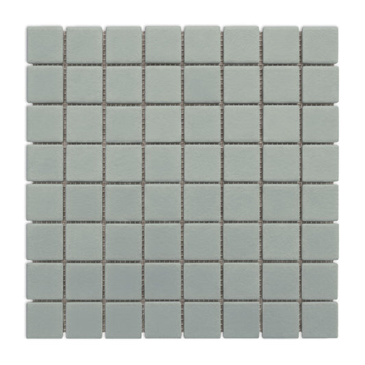Agave green clay mosaic tiles from Clay Imports, arranged in a grid pattern with light grout.