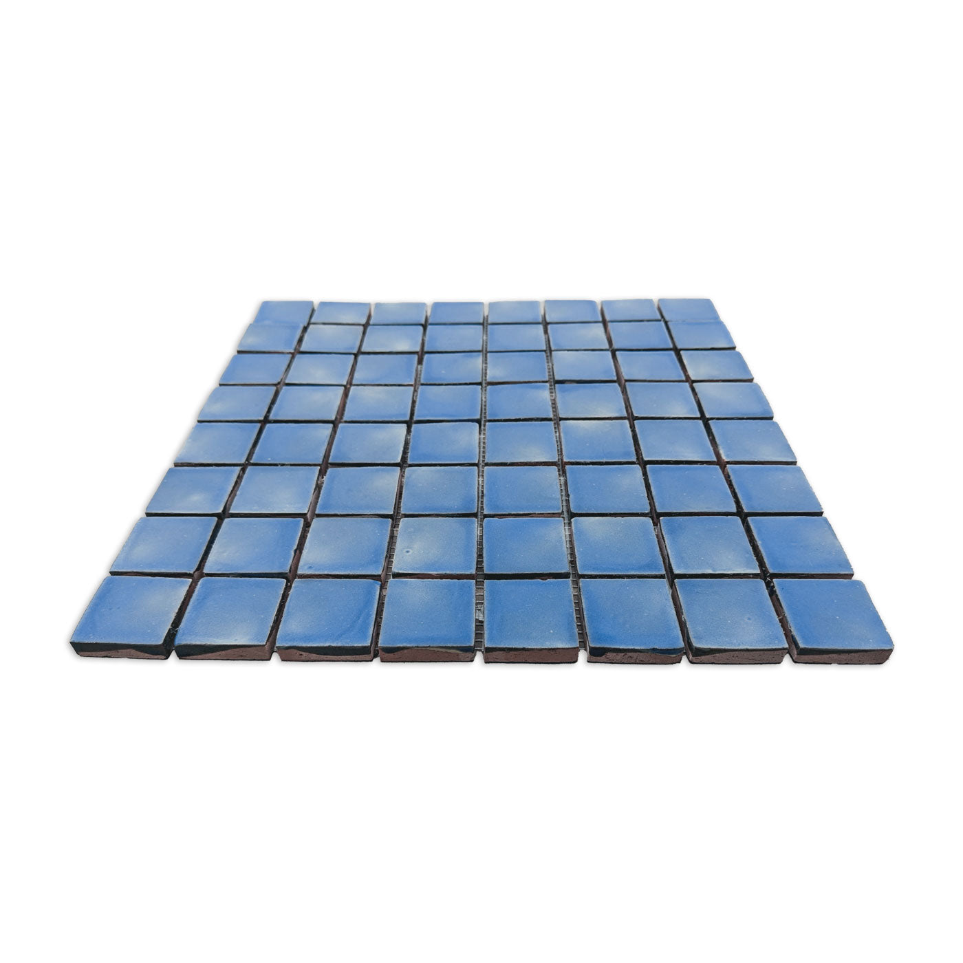 Blue meshed clay mosaic tile sheet by Clay Imports, featuring small squares with uneven surfaces and unglazed terracotta sides.