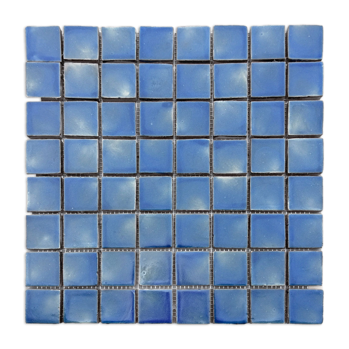 Blue square clay tiles by Clay Imports with varied light and dark shades arranged on a mesh sheet.