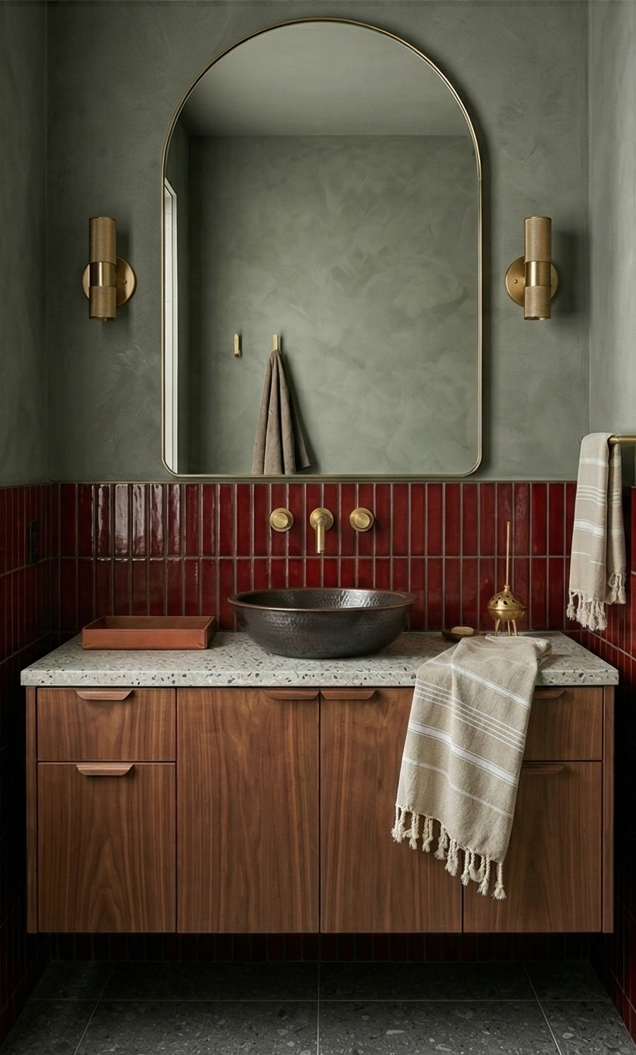 Oxblood red 1.5x6 matchstick tile by Clay Imports, installed vertically as a glossy bathroom backsplash.