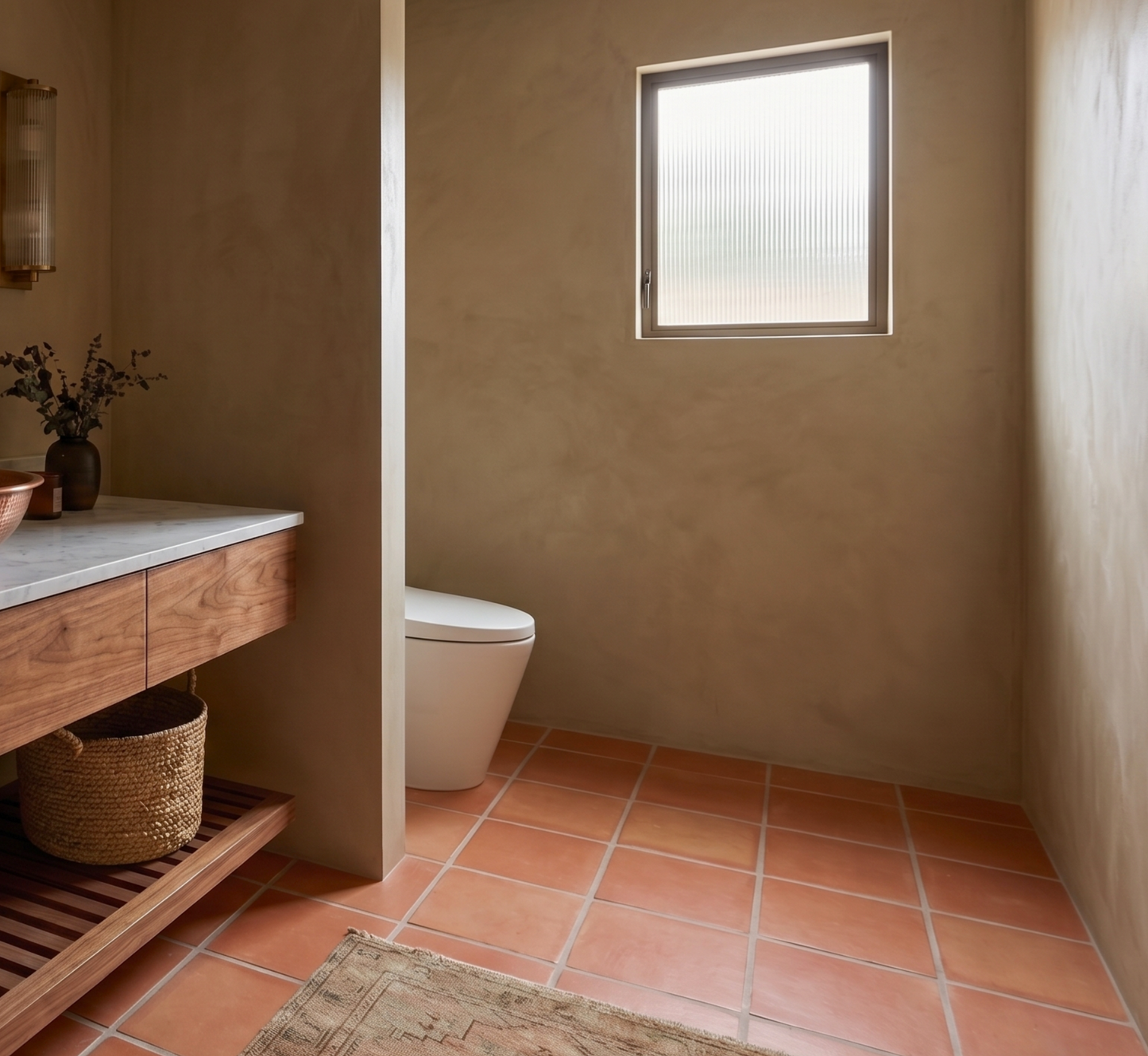 Red terracotta floor tiles by Clay Imports, showcased in a modern bathroom with warm beige walls.