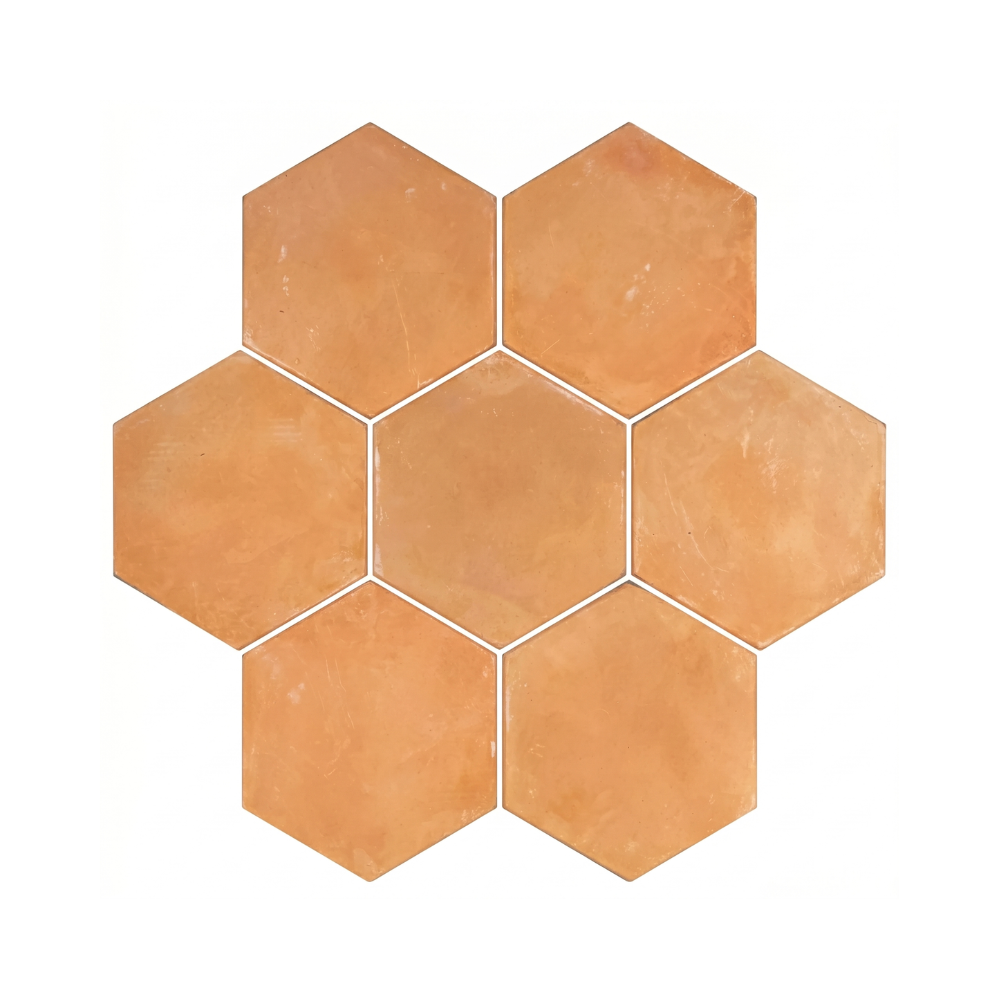 Organic terracotta hexagon tiles by Clay Imports, arranged in a seven-tile cluster with white grout lines.