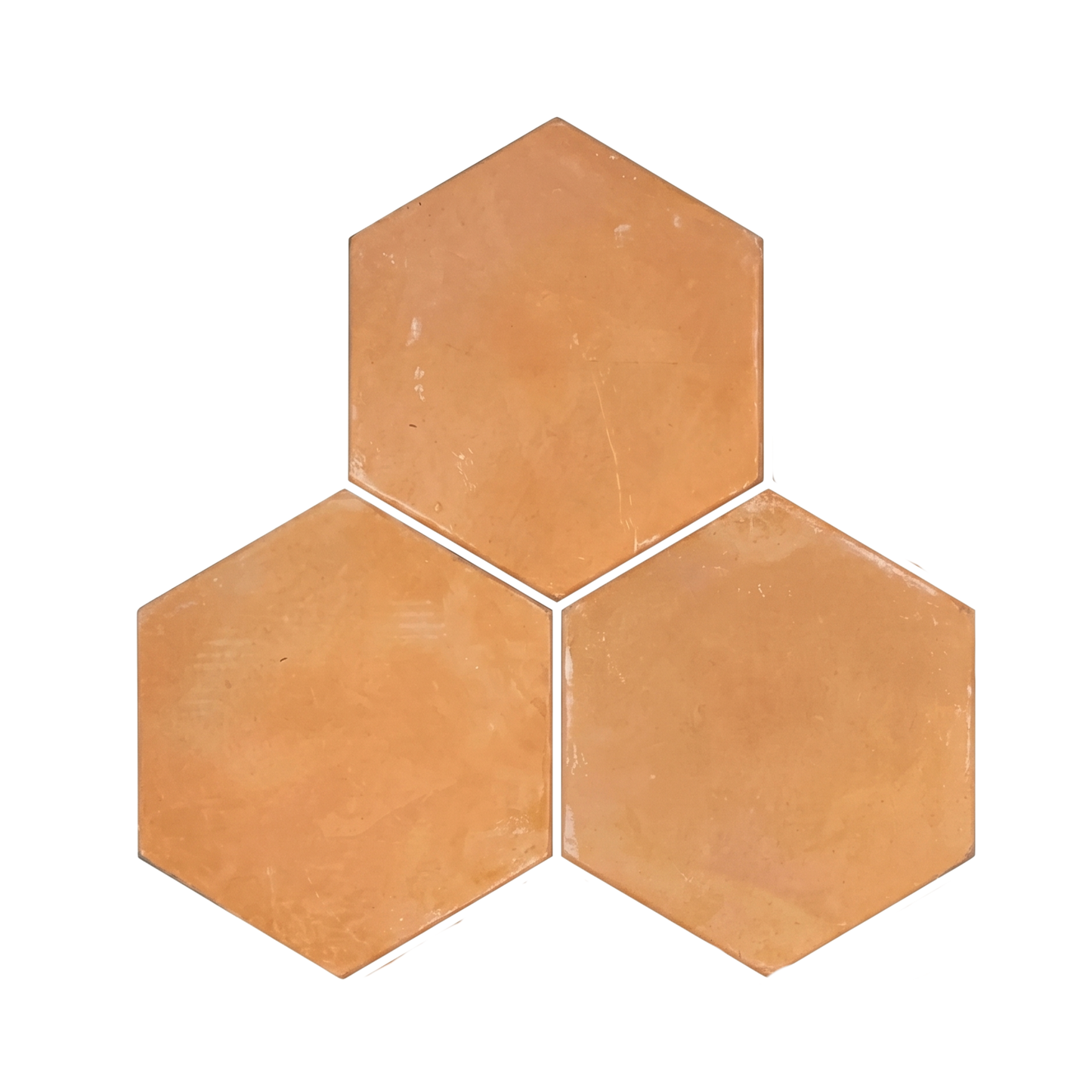 Organic terracotta hexagon tiles from Clay Imports in a light orange-brown hue, arranged in a cluster of three.