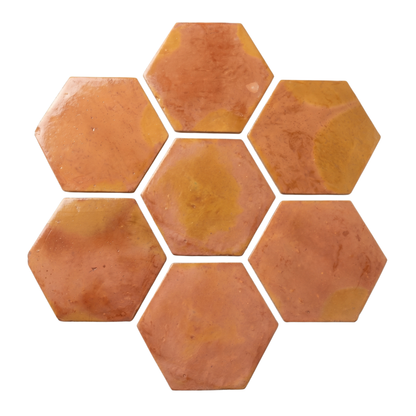 Terracotta hexagon tiles by Clay Imports, warm orange-brown, arranged in a seven-tile cluster.