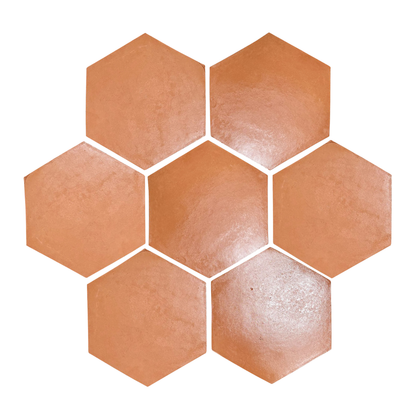 Red hexagon terracotta tiles by Clay Imports arranged in a cluster with a textured, matte finish.