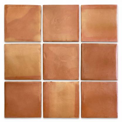 Orange-brown terracotta tiles by Clay Imports arranged in a 3x3 grid, showcasing natural color and texture variations.