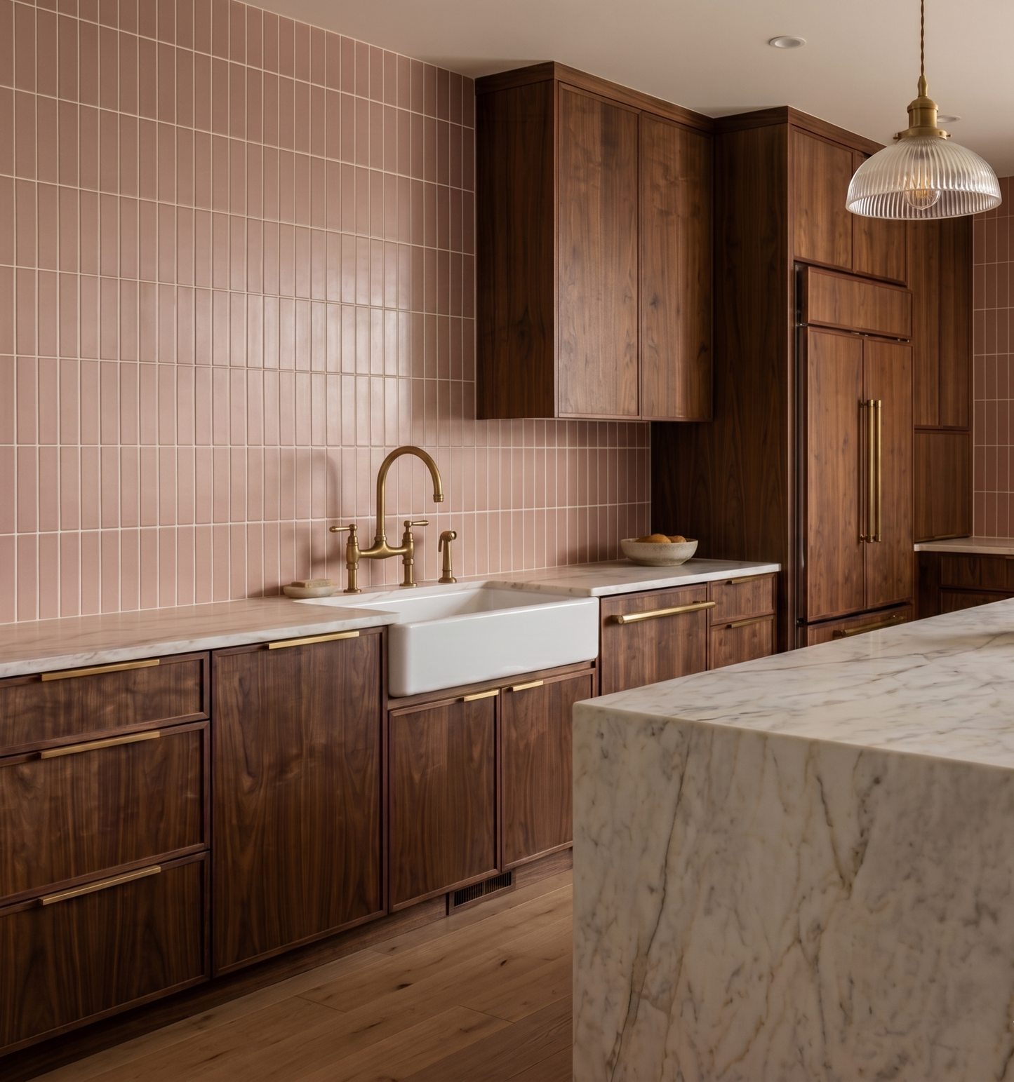 Dusty rose opaque 2x8 clay tile by Clay Imports installed vertically as a kitchen backsplash with white grout.