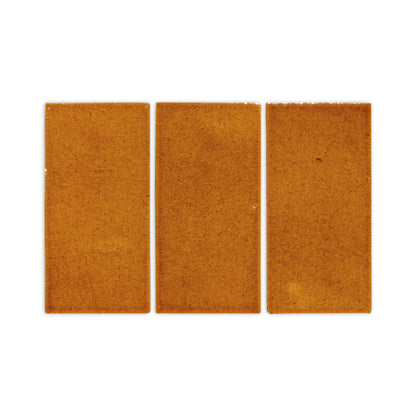 Three rectangular terra cotta crackle clay tiles by Clay Imports, laid horizontally with textured, glazed surfaces on a white background.