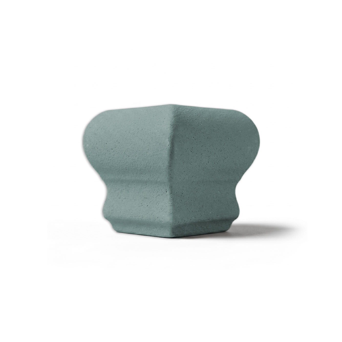 Light grey-green Chair Rail Corner tile by Clay Imports, with a sculpted profile and rounded top and base.