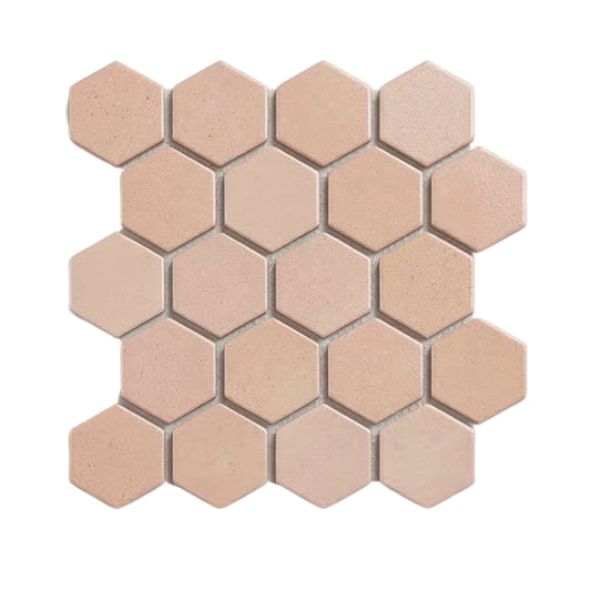 Opaque hexagon meshed clay tiles in light peach-beige by Clay Imports, displaying textured surfaces and light gray grout.