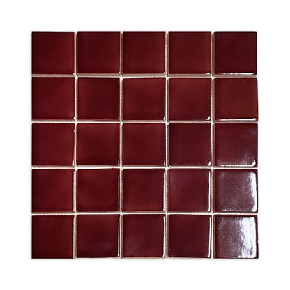 Glossy oxblood square clay tiles by Clay Imports, arranged in a uniform grid with light grout.