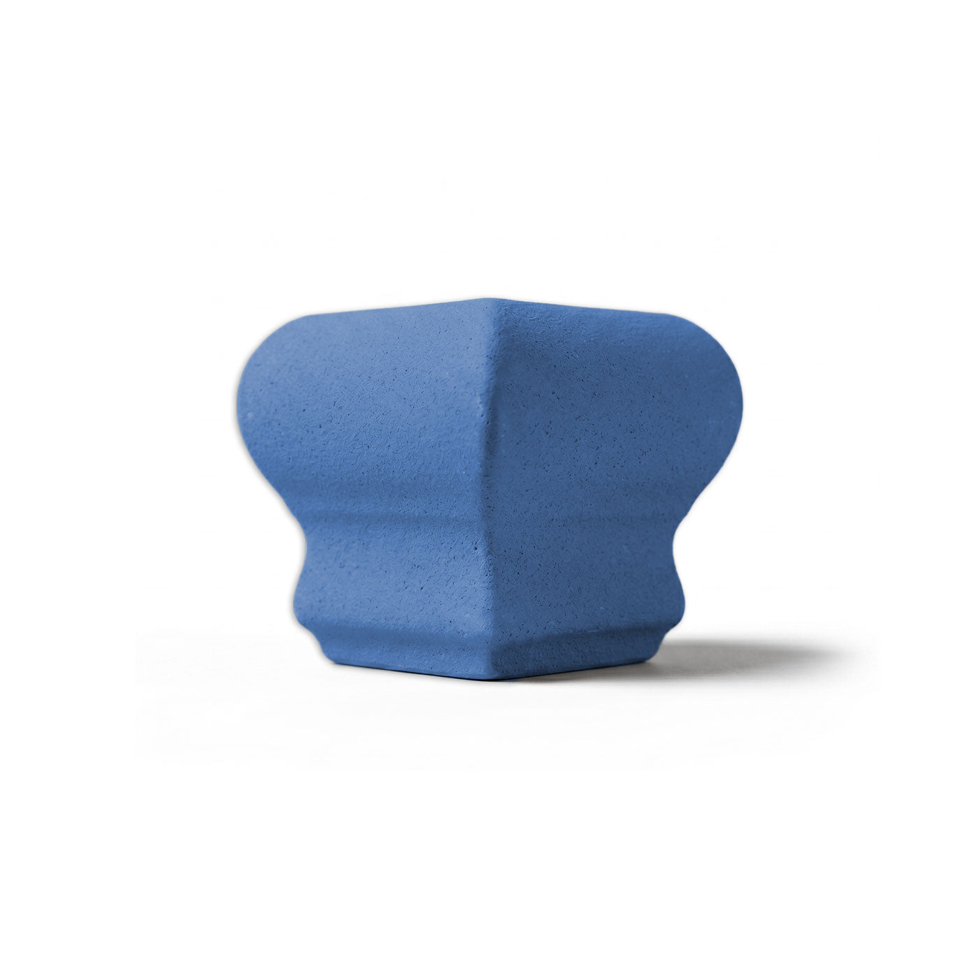 Denim blue chair rail corner tile by Clay Imports, featuring a smooth finish and a curved, architectural profile.