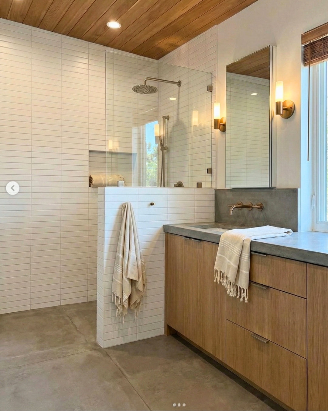 White Mirage Matte 2x12 solid tile by Clay Imports, installed horizontally on modern bathroom and shower walls.