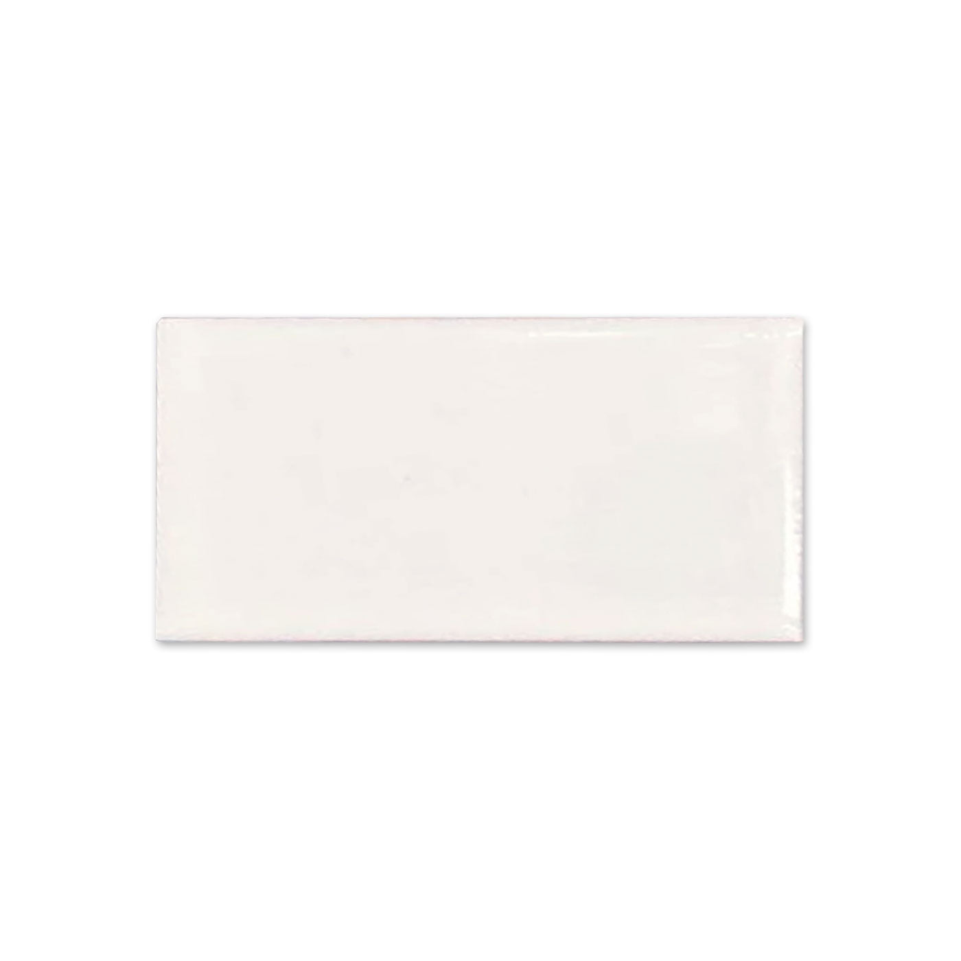 Off-white glossy rectangular tile sample from Clay Imports with subtle surface irregularities.