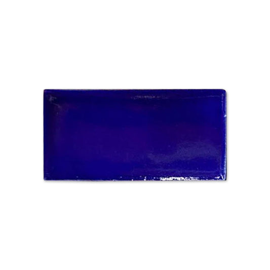 Vibrant cobalt blue rectangular tile sample by Clay Imports with a high-gloss finish.