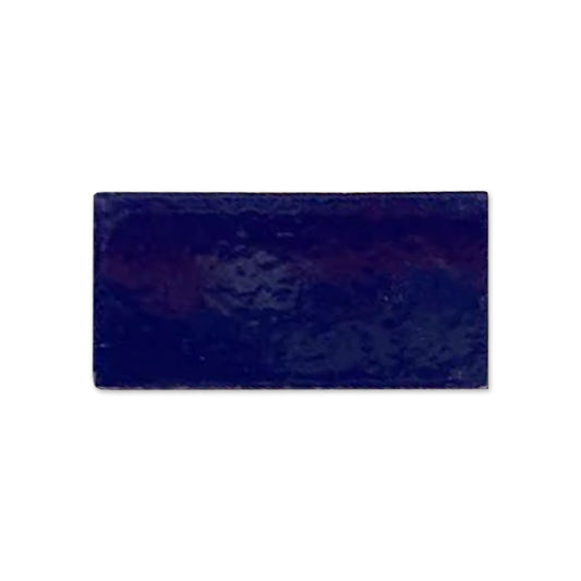 Dark blue glossy rectangular sample tile by Clay Imports, featuring an uneven texture and reflective surface.