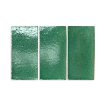 Three green rectangular gloss tile samples by Clay Imports, showing a varied, textured surface.