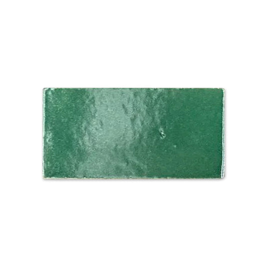 Green glossy rectangular tile sample by Clay Imports with a slightly uneven, reflective surface.