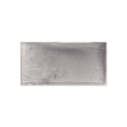 Graphite gloss tile sample by Clay Imports, a dark grey rectangular piece with subtle texture and soft edges.