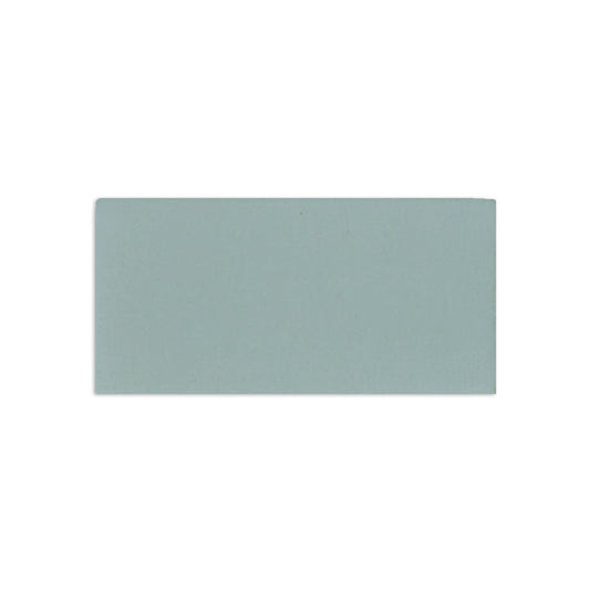 A hot spring matte sample by Clay Imports, a light blue-grey rectangular tile with a subtle, uniform texture.