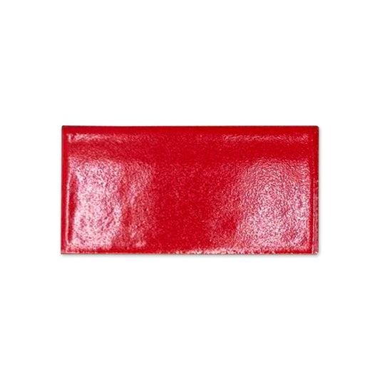 Red poppy gloss sample tile by Clay Imports with a textured surface.