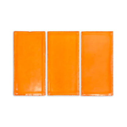 Three rectangular orange Sherbet Gloss samples by Clay Imports, featuring a glossy finish and subtle edge imperfections, on white.