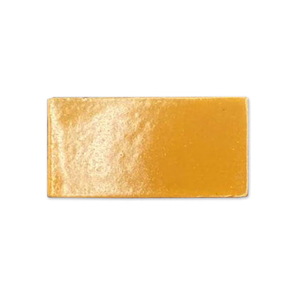 Sitron yellow gloss tile sample by Clay Imports, a rectangular piece with a slightly textured, shiny surface.