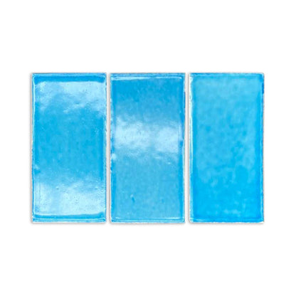 Three turquoise gloss tile samples by Clay Imports, rectangular with a handmade, textured appearance on a white background.