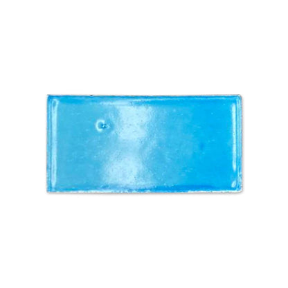 Turquoise gloss sample by Clay Imports, a rectangular tile with a glossy finish and small surface imperfection.