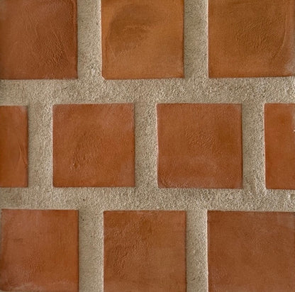 Cotto Umber square tiles by Clay Imports with rough, light-colored grout lines.