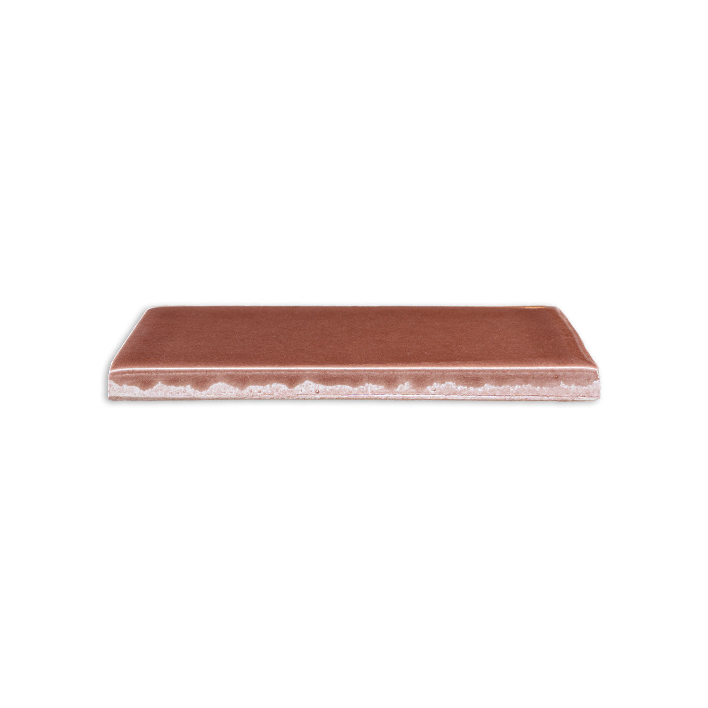 Tamarindo Gloss solid tile by Clay Imports, a reddish-brown rectangle showing its lighter, textured underside.