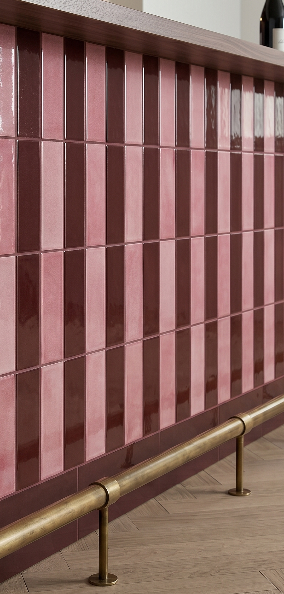 Pink and brown striped tiles with a gold handrail on a wooden floor.