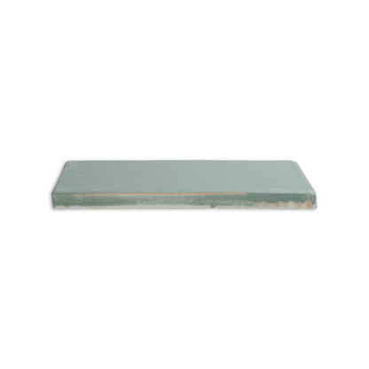 Rectangular Hot Spring clay tile by Clay Imports, showing its unglazed side with a tan edge and speckled texture.
