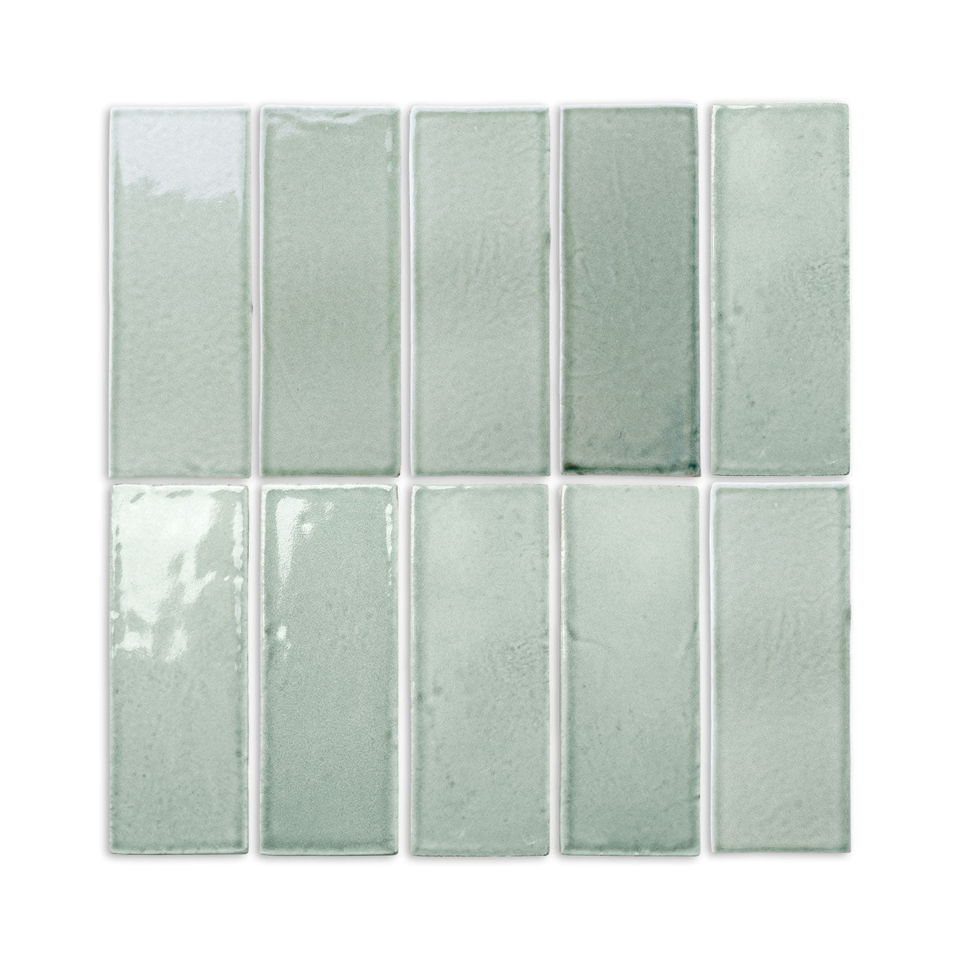 Arctic gloss 2x6 subway tiles by Clay Imports, arranged in a grid, featuring subtle texture variations.
