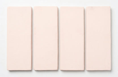 Matte light pink rectangular tiles by Clay Imports, arranged vertically with soft edges.